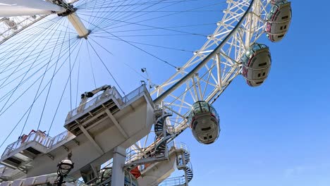 ferris wheel rotating against a clear blue sky