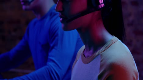 Woman-and-man-working-together-at-computers