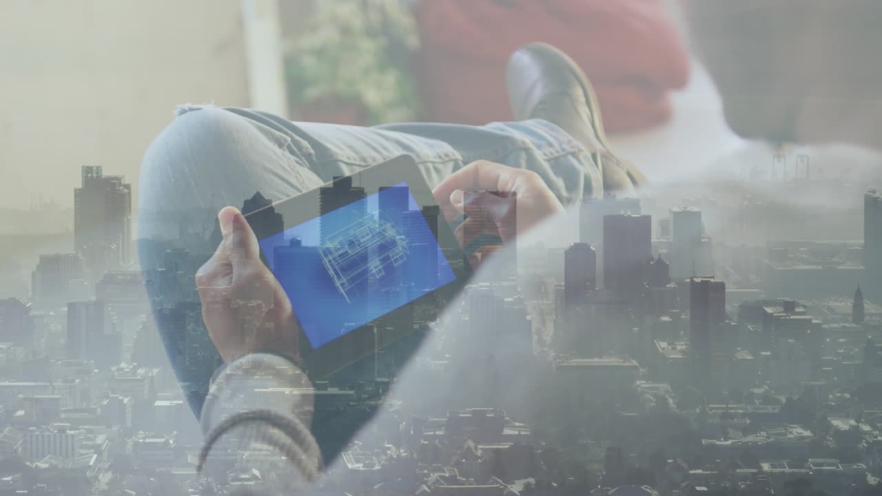 Man reclining on couch tilting tablet, swiping 3D model, animating market skyline charts for review