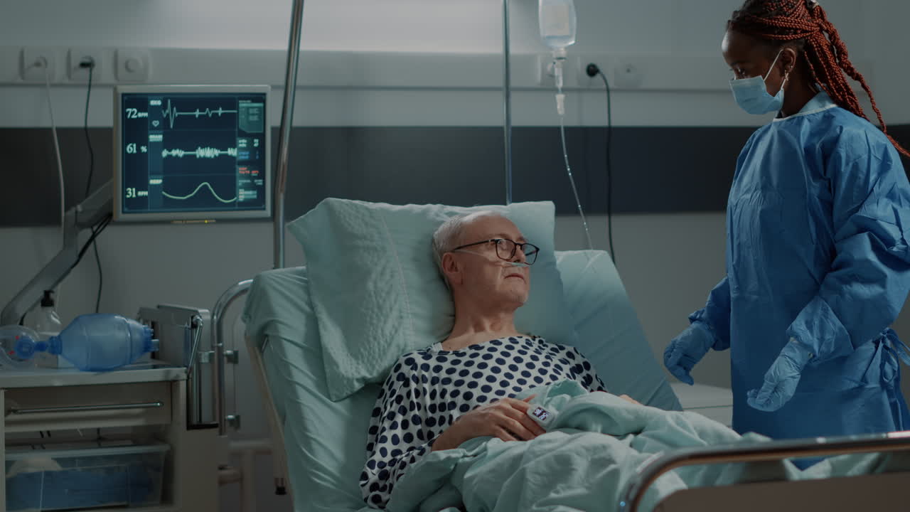 Hospital ward medical surgeon talking to sick patient