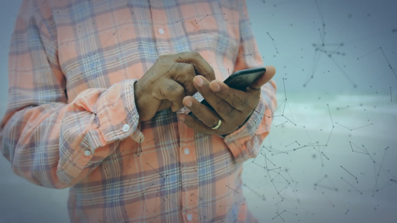 Using smartphone, person viewing animation of digital network connections in school