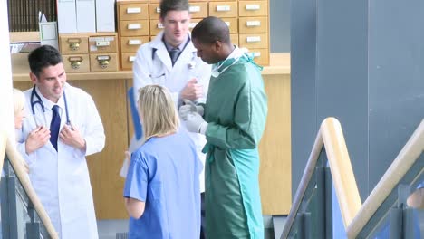 Medical-team-speaking-in-the-hall-of-a-hospital-footage