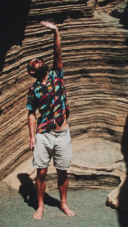 man exploring a natural canyon