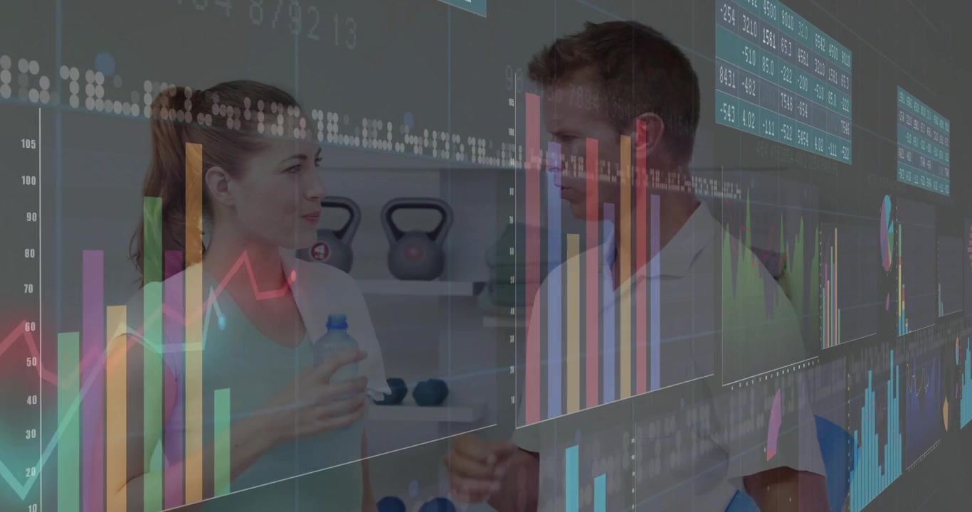 Data overlays guiding trainer coaching trainee on health charts while trainee sipping water bottle