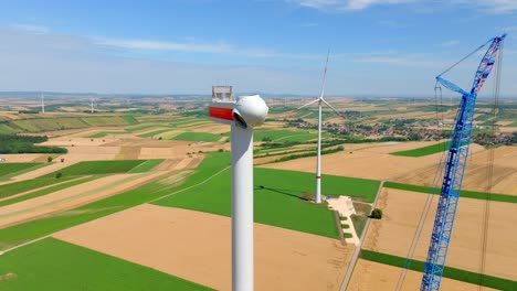 the head of wind turbine under construction - pan down shot