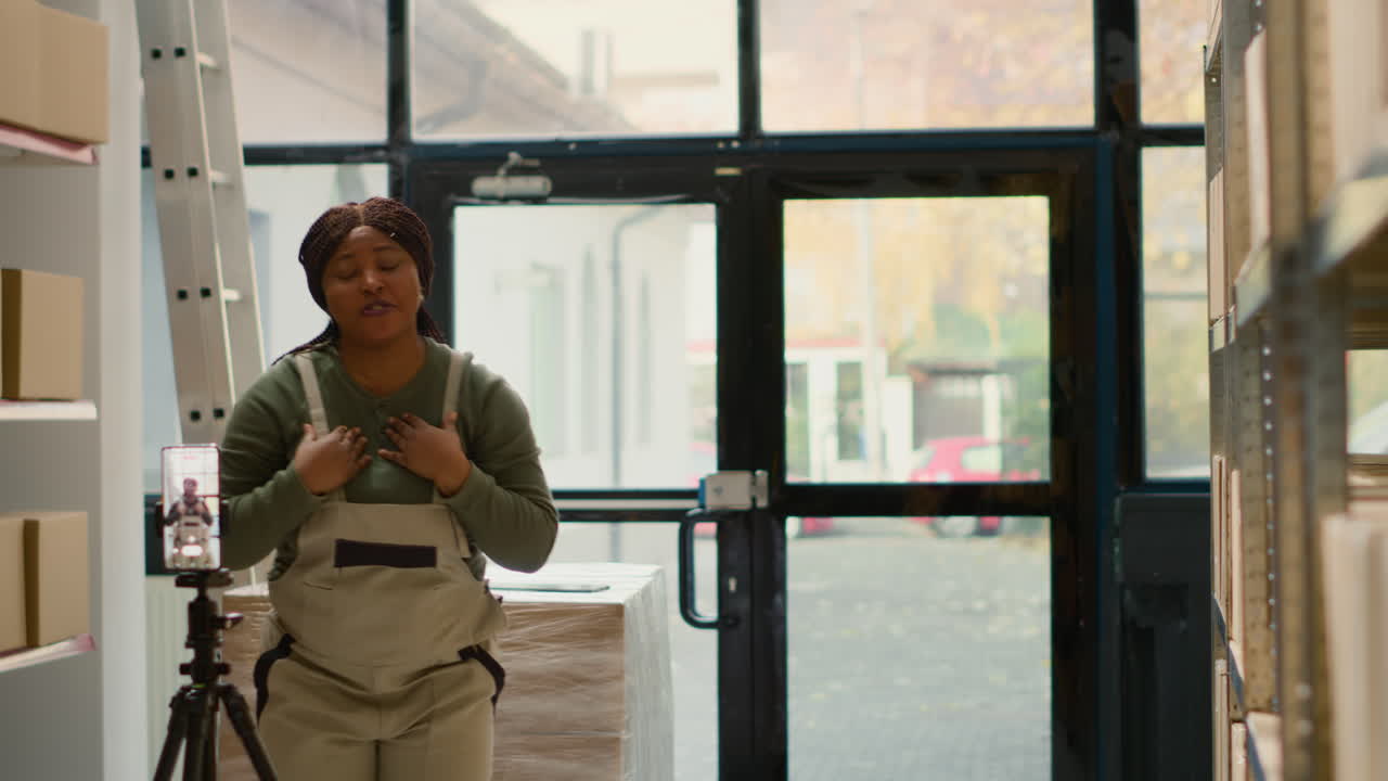 Warehouse workers recording a video