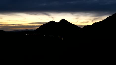 Time-lapse-of-cars-driving-on-Ramona-expressway-with-the-mountains-silhouette