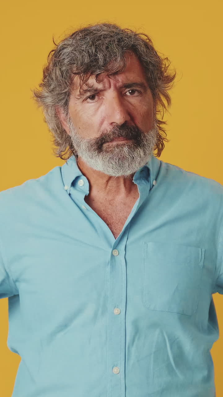 Mature Man Shaking Head No and Nodding Yes