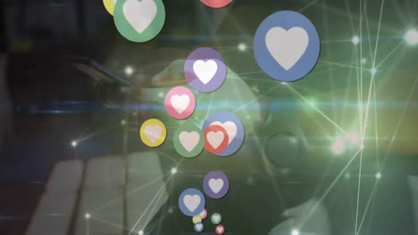 Animation-of-heart-icons-and-network-of-connections-over-mid-section-of-a-man-using-smartphone