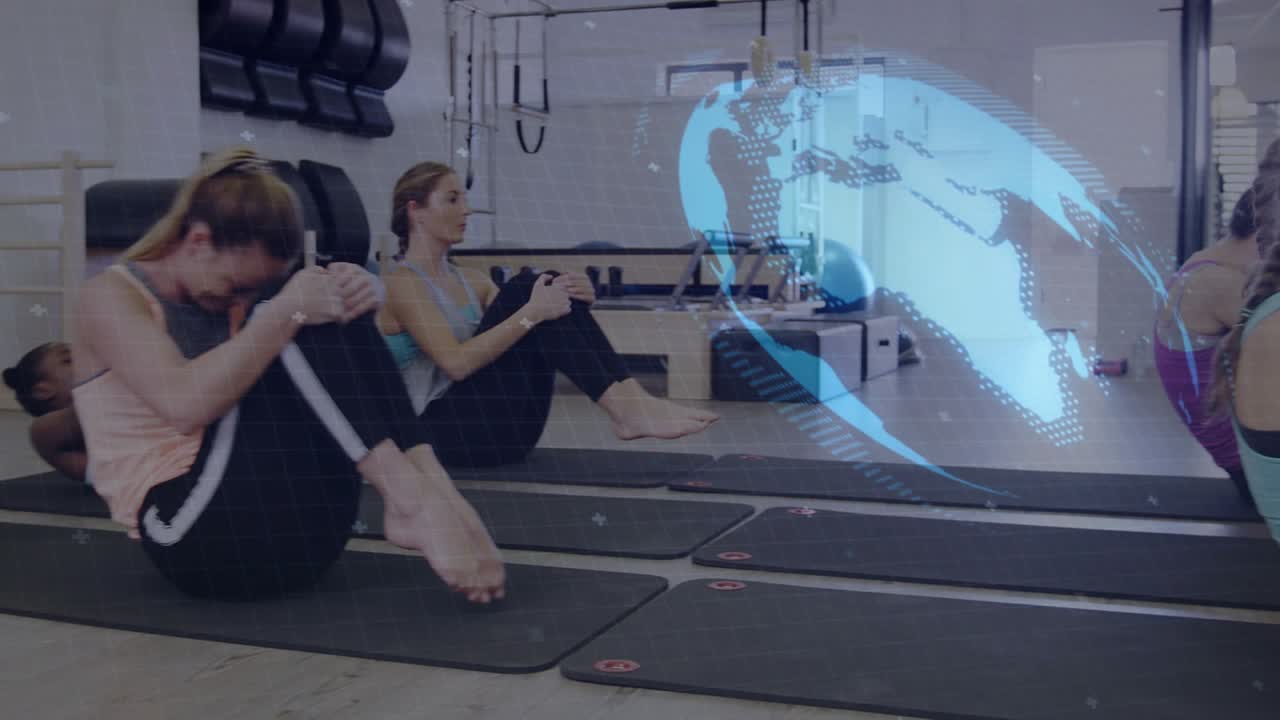 Woman in blue tank starting core roll by tucking for pilates core strength, globe overlay syncing