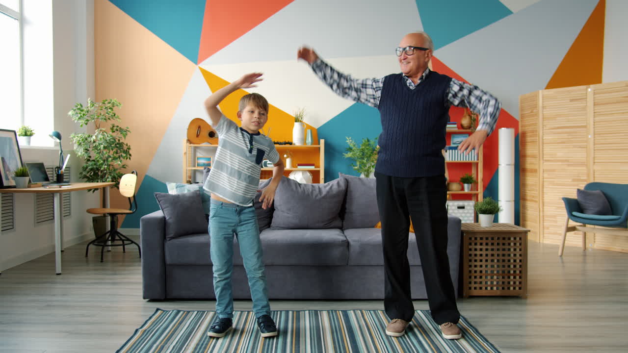 Grandfather and Grandson Exercising Together at Home