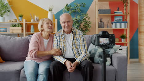 elderly couple recording a video