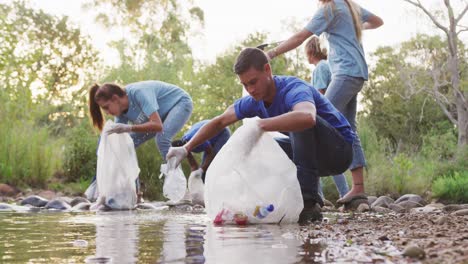 mid adults volunteering during river clean-up day