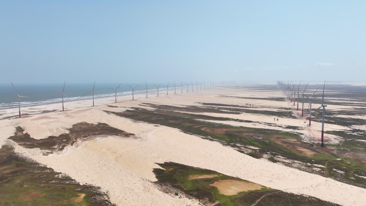 Endless Wind Turbines at the Beach - Green Energy Production AERIAL