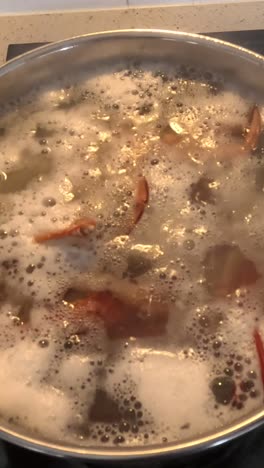boiling pasta with seasoning in pot