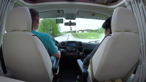 man driving on a road in the camper van rv