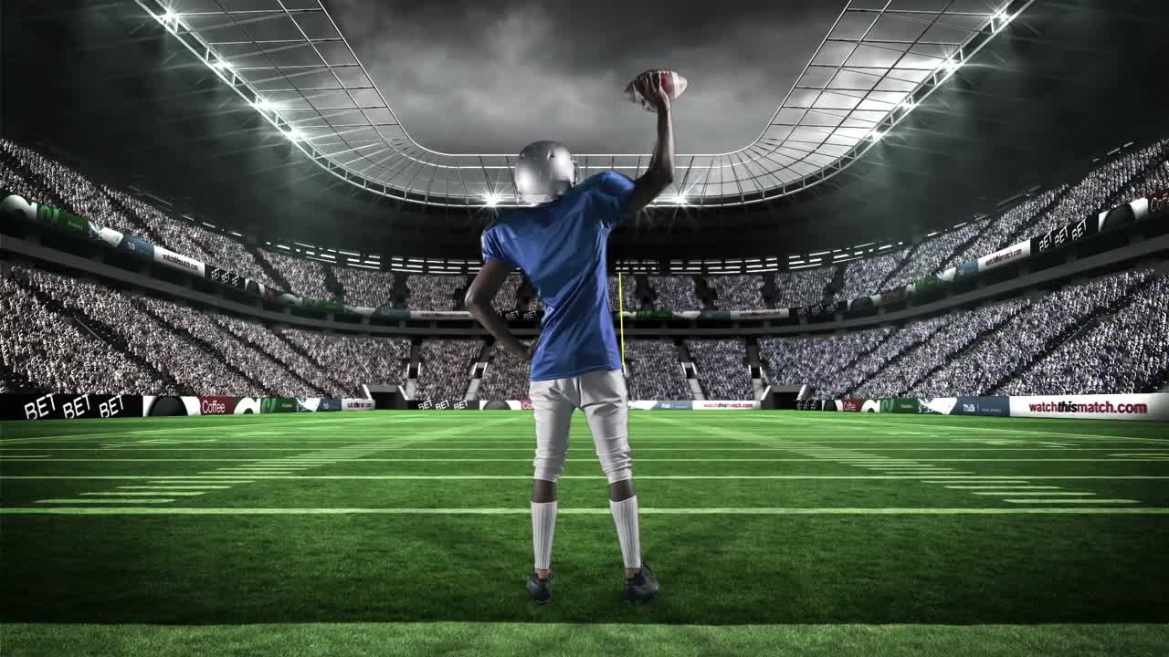 아메리칸  ⁇ 볼 선수 가 팔 을 들고 있다