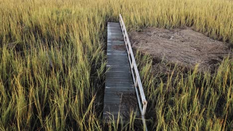 Flyover-of-boardwalk-isolated,-broken,-and-a-path-to-nowhere-after-hurricane-damage