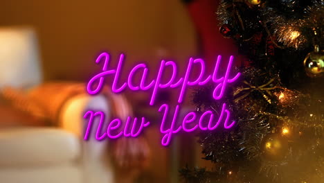 animation of happy new year text over christmas tree
