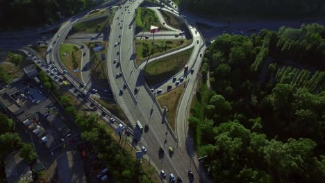 aerial view cars driving on highway junction. cars motion on freeway overpass