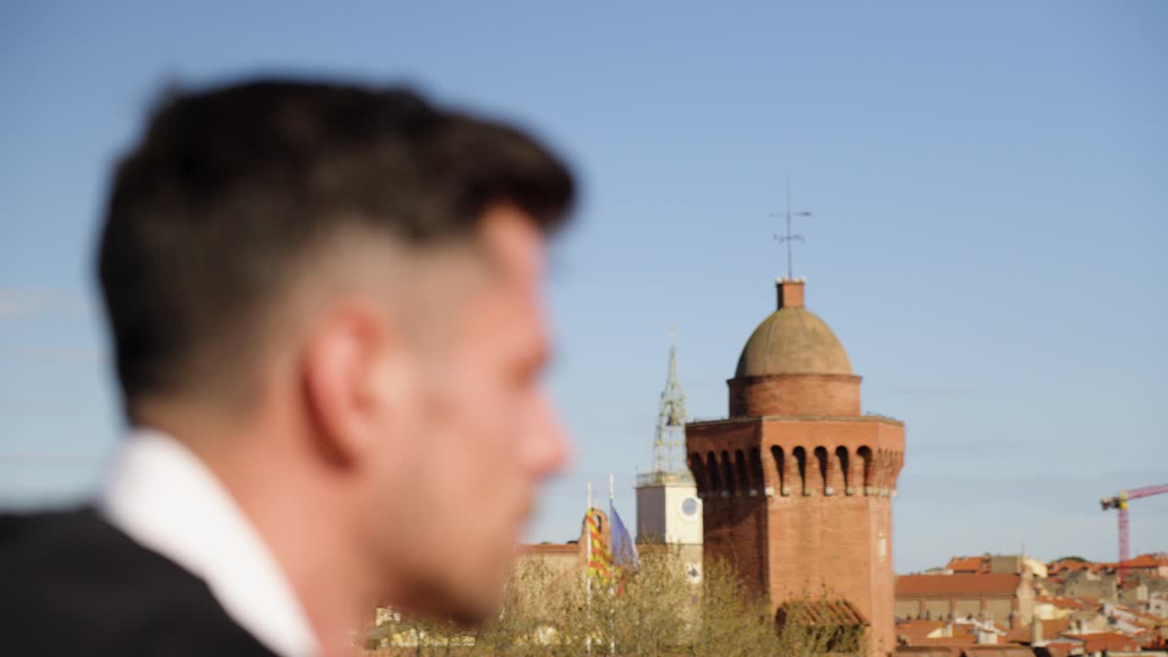 man sitting enojying the views of the Montpellier skyline during the day