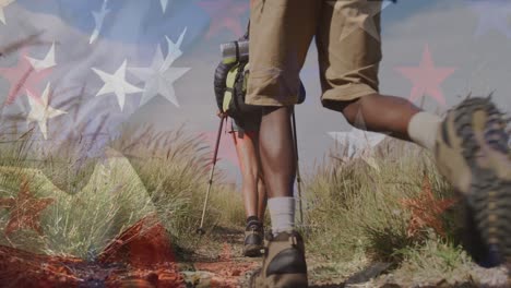 animation of flag of united states of america over people hiking in mountains