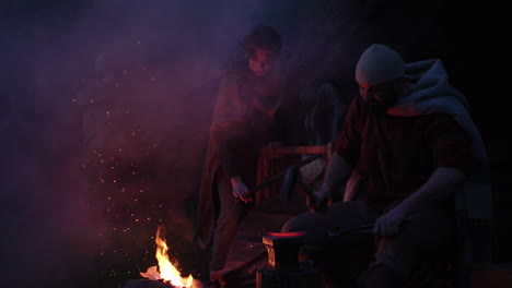 medieval blacksmith at night