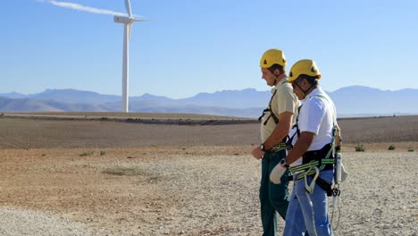 two male engineer walking in the wind farm 4k
