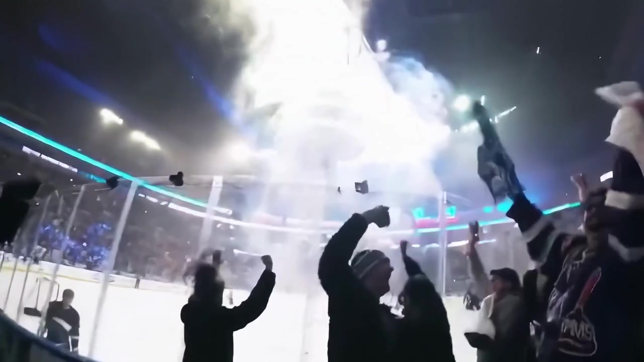 Excited Hockey Fans Cheering During a Goal Celebration