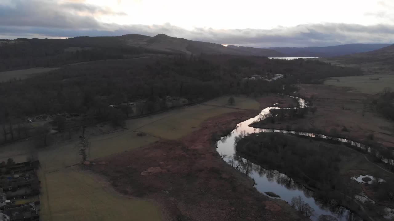 Drone footage. Hovering over the green Scottish plane and river Teith.