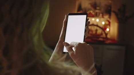 woman at home using screen smartphone in vertical portrait mode. pov view