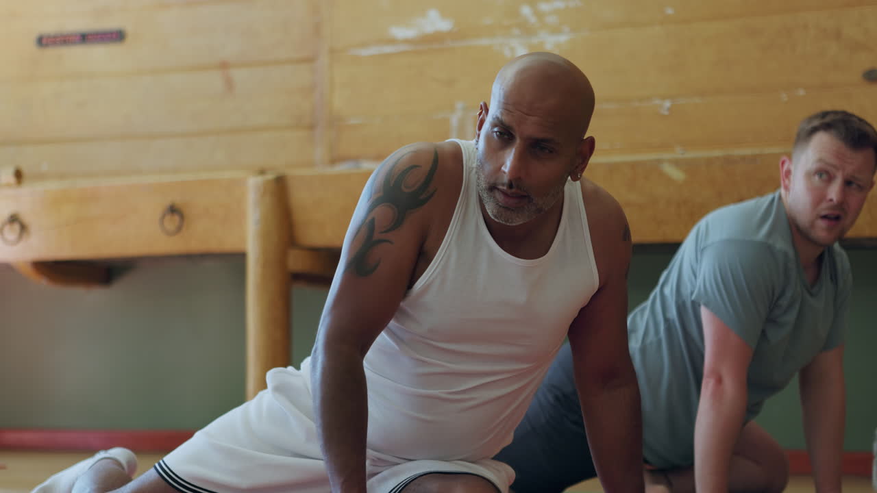 Men doing yoga exercises