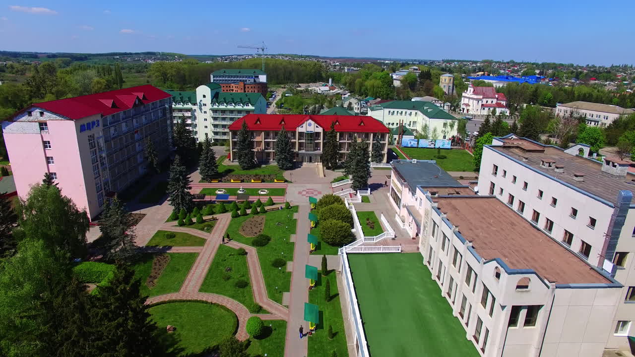 Beautiful new colorful buildings with well-kept area of the yard. Sunny day footage over the city.