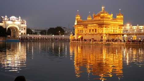 panning shot of golden temple at night in amritsar