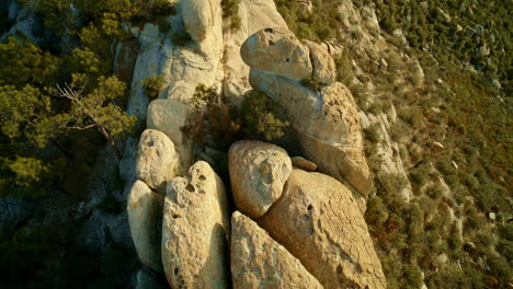 drone shot looking straight down at hoodoo rock formations and desert flora in the mountains near tucson arizona