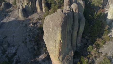 Aerial-tilt-up-shot-of-a-rock-formation-in-El-Valle-de-loss-Monies,-Copper-Canyon-Region,-Chihuahua