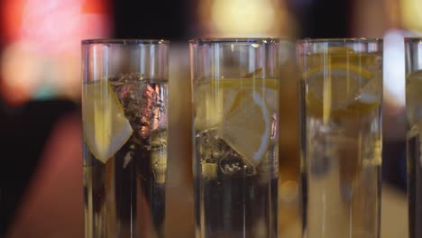 Close-shot-of-some-tequila-shots-with-a-blurry-background