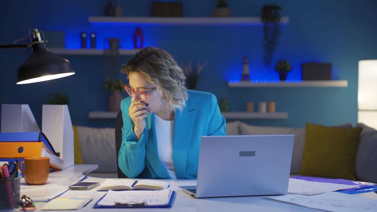 Home office worker woman is sick and coughing.