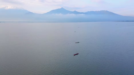 aerial view: group of fishing boats on lake catching fish for business in asia
