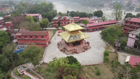 drone footage gracefully circling devdaha temple in chitwan, nepal, showcasing sacred architecture and lush surroundings from all angles. perfect for cultural, travel, and spiritual content