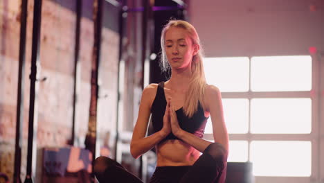 Slow-Motion-Of-Attractive-Female-Athlete-Practicing-Yoga-At-Health-Club