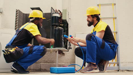 Colleagues-servicing-condenser