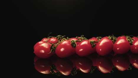 Juicy-red-cocktail-tomatoes-super-macro-close-up-with-dark-background-unique-high-resolution-4k-shoot-Glossy-reflection