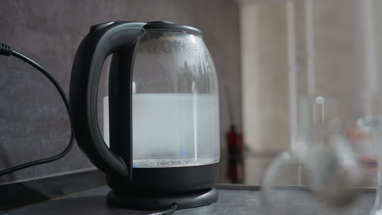 Electric Kettle With Indicator Light, Home Kitchen Scene With Hot Water Being Prepared In Electric Kettle, Scene Showcasing Electric Kettle On Kitchen Counter Heating Water With Indicator Light