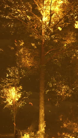 forest fire engulfing trees during a nighttime blaze in a wooded area