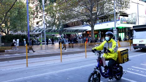 bikes, trams, and pedestrians in city traffic