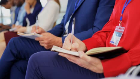 business people writing on notepad in the business seminar 4k