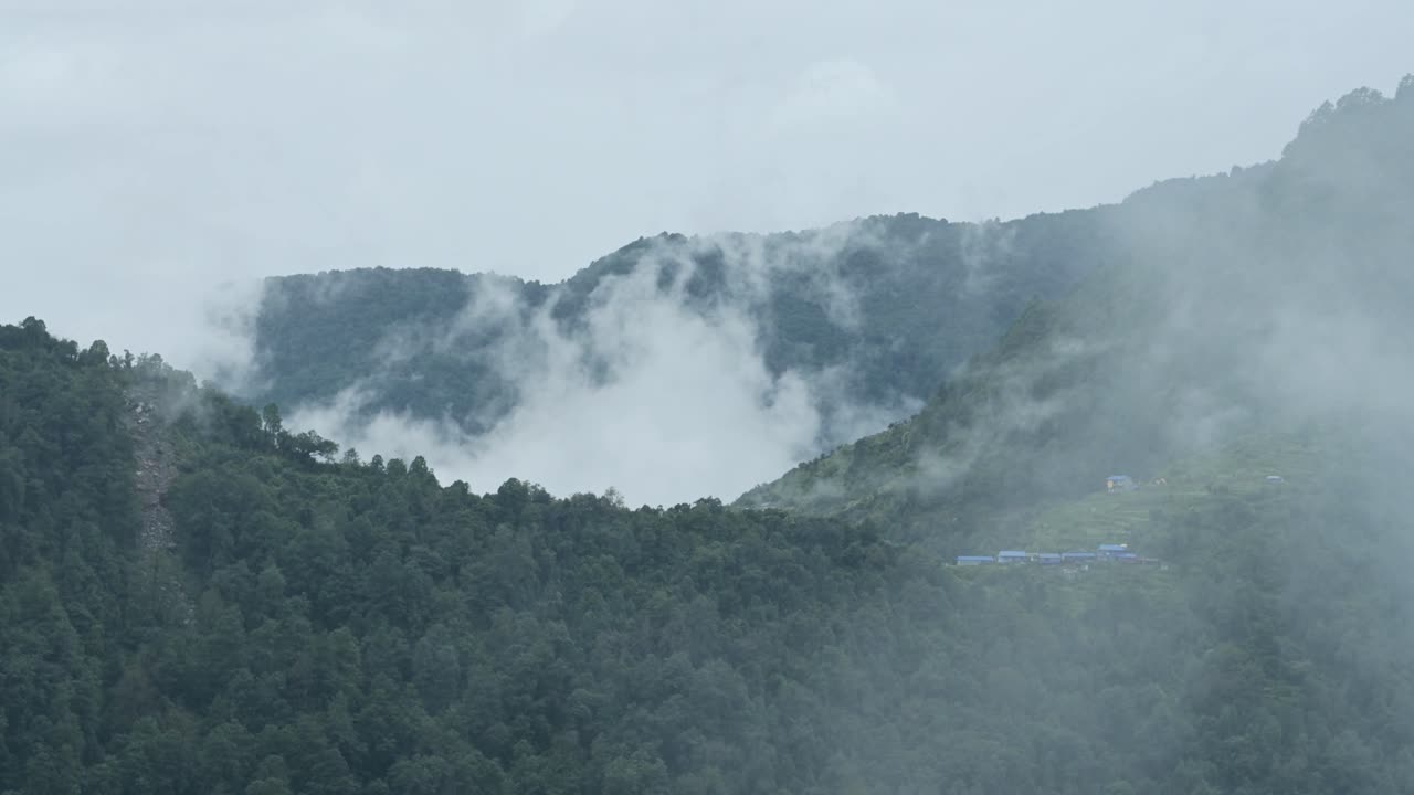 Remote Himalayas Village in Nepal, Mountain Forest Ridge with Trees and Houses in a Remote Mountain Village in Nepal