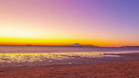 Vibrant-glowing-seaside-sky-during-sunset-or-sunrise,-time-lapse-view