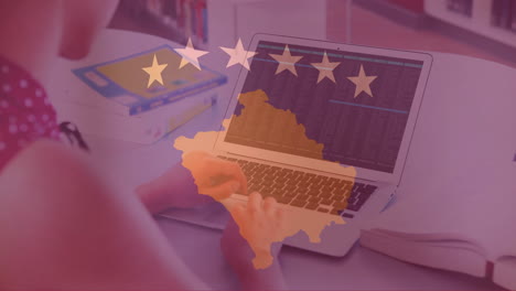 animation of flag of kosovo over caucasian woman using laptop